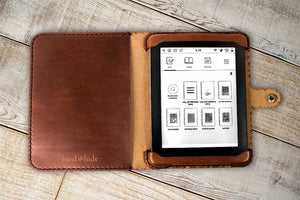 a kindle case sitting on top of a wooden table